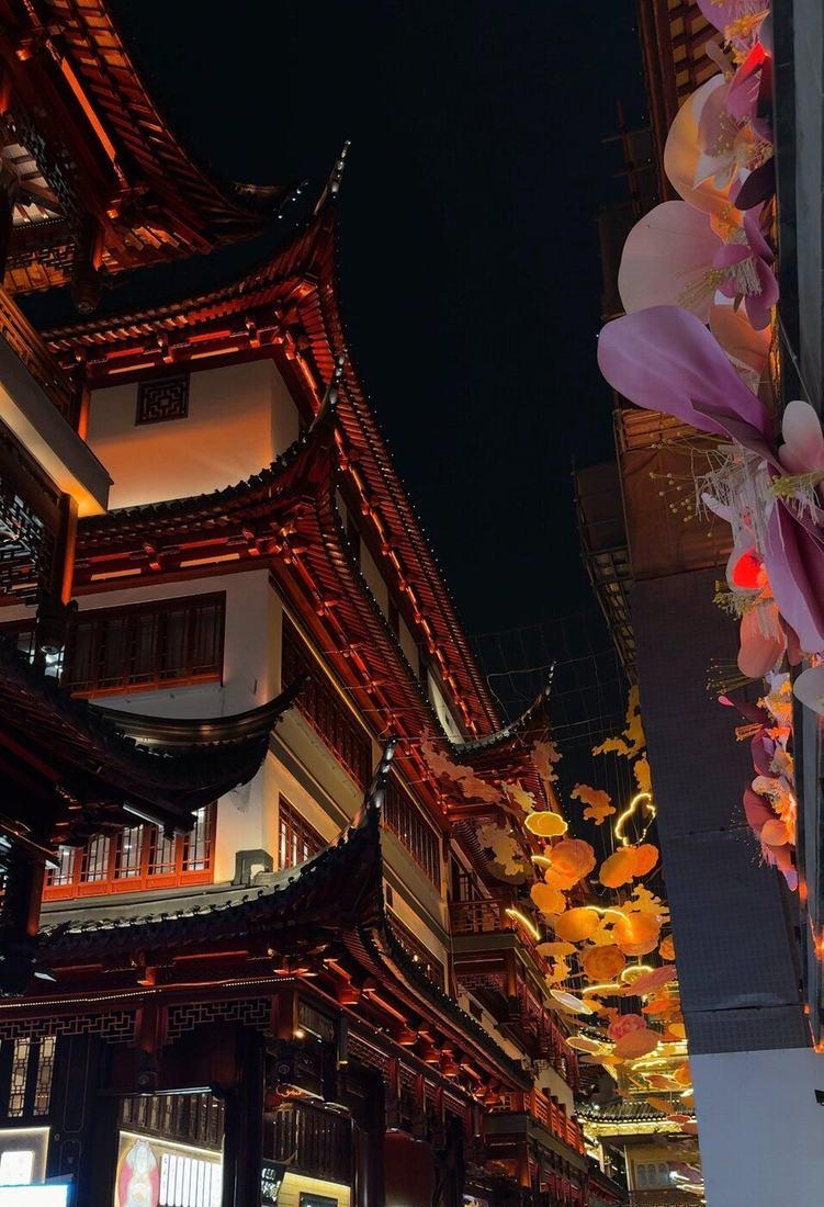 Lanterns and traditional rooftops at night