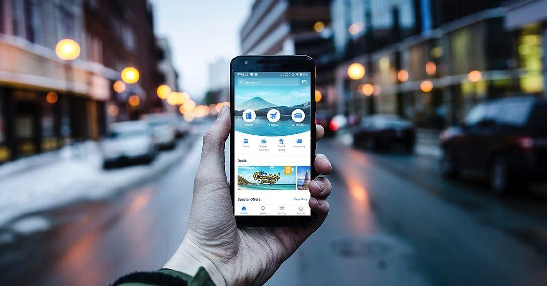 Booking a trip on a phone on a city street at dusk