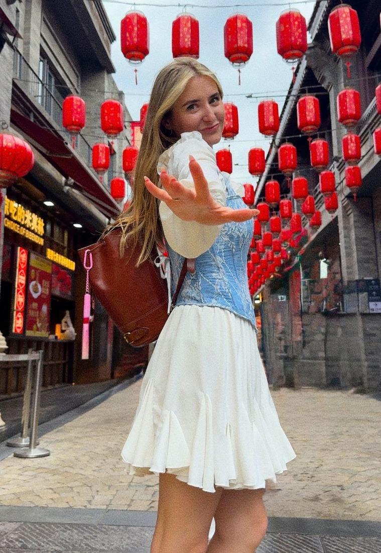 Red lanterns strung above a Beijing shopping street