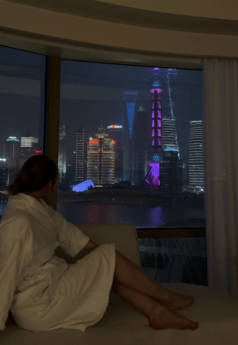 The Pudong skyline at night from a hotel window
