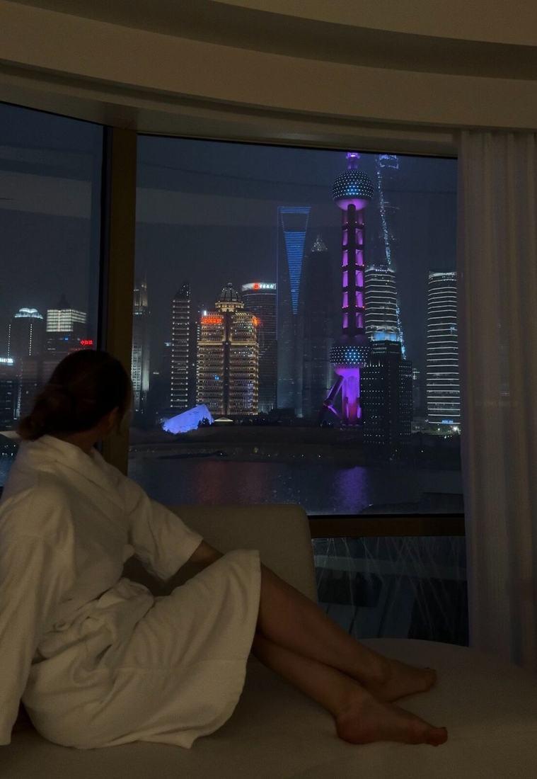 The Pudong skyline at night from a hotel window