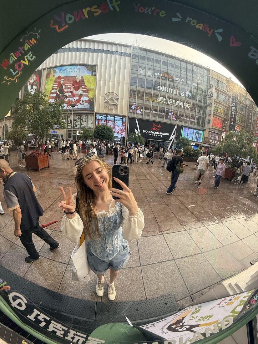 Selfie through a fisheye mirror on Nanjing Road in Shanghai